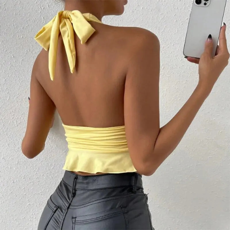 Elegant women's top with deep V-neck and pleats