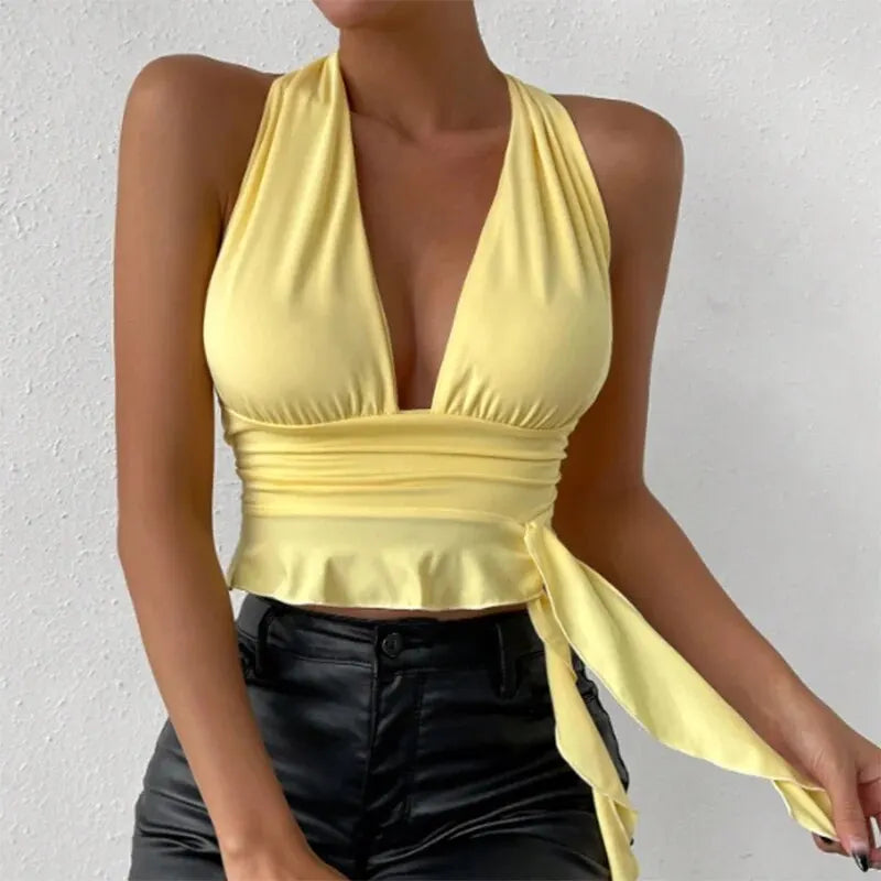 Elegant women's top with deep V-neck and pleats