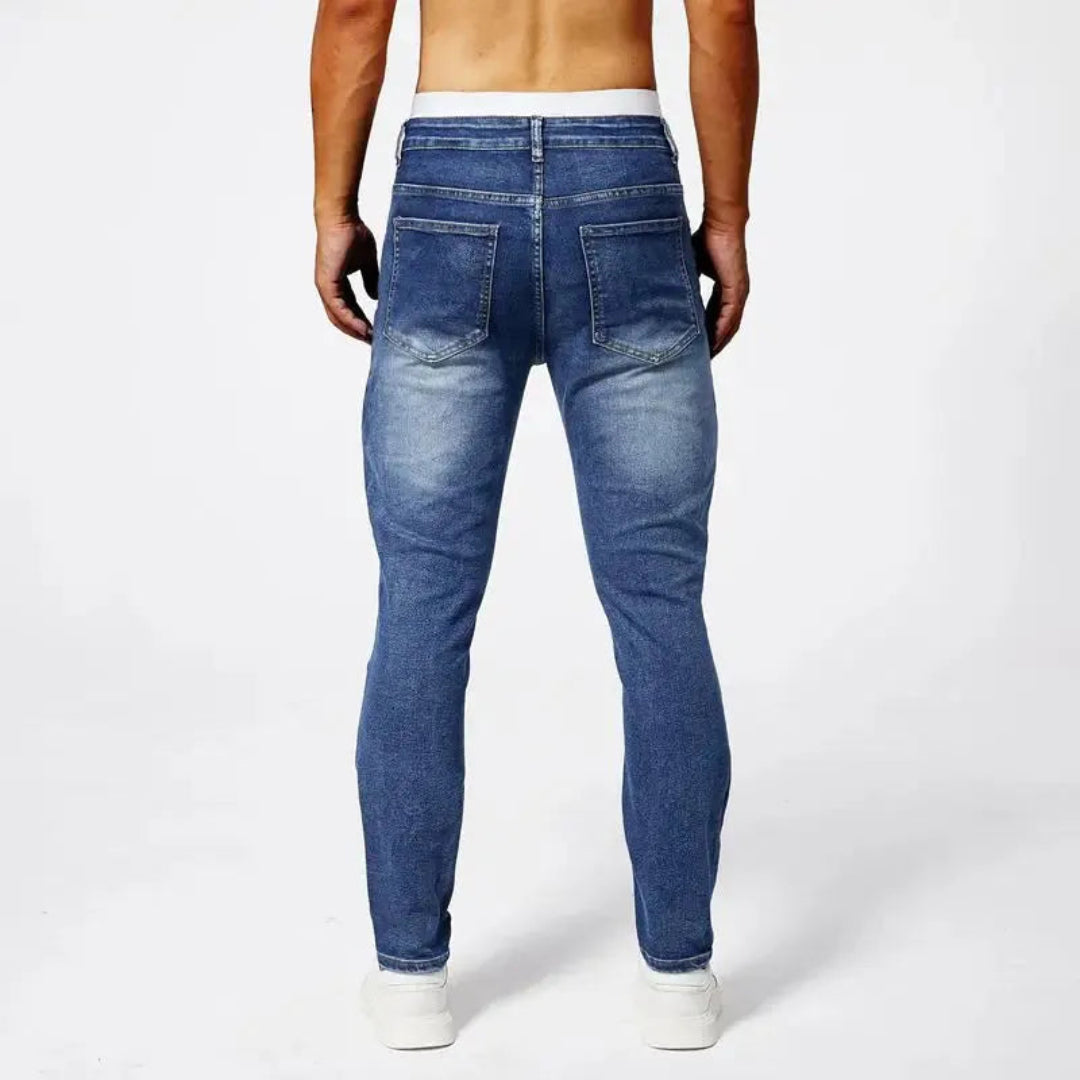 Jeans Moto de corte ajustado en denim elástico premium con costuras de panel