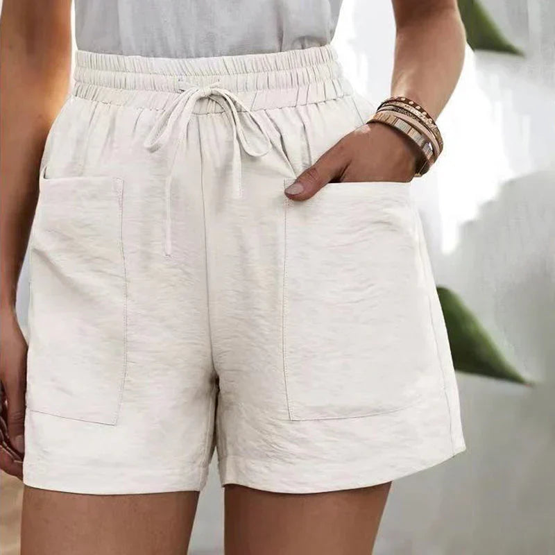 Avslappnade linne-shorts för kvinnor med elastisk midja och framfickor