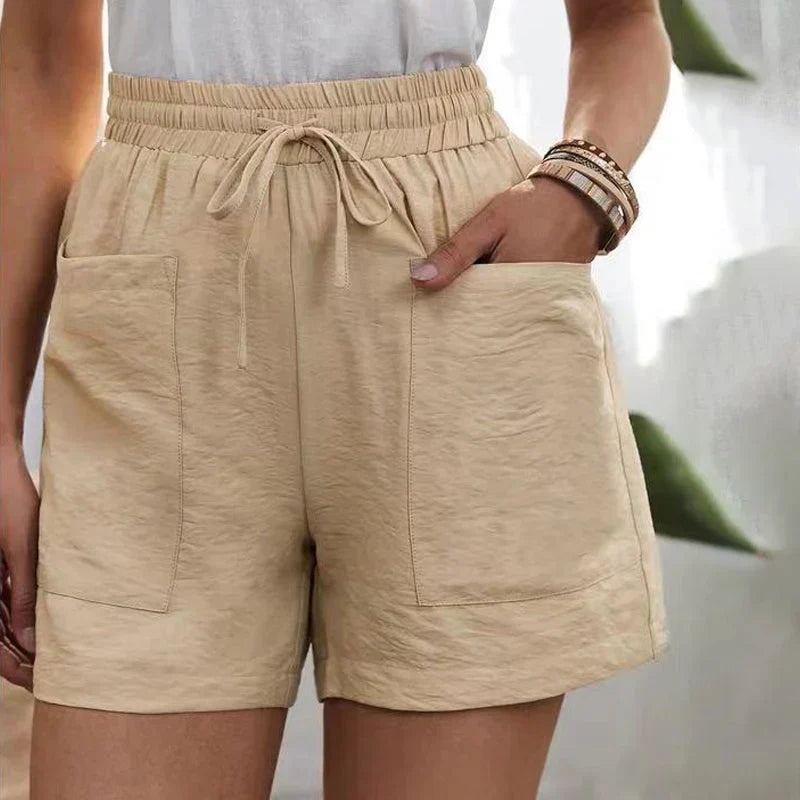 Avslappnade linne-shorts för kvinnor med elastisk midja och framfickor